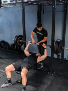  Personal trainer working one-on-one with client at fitness studio in Los Angeles
